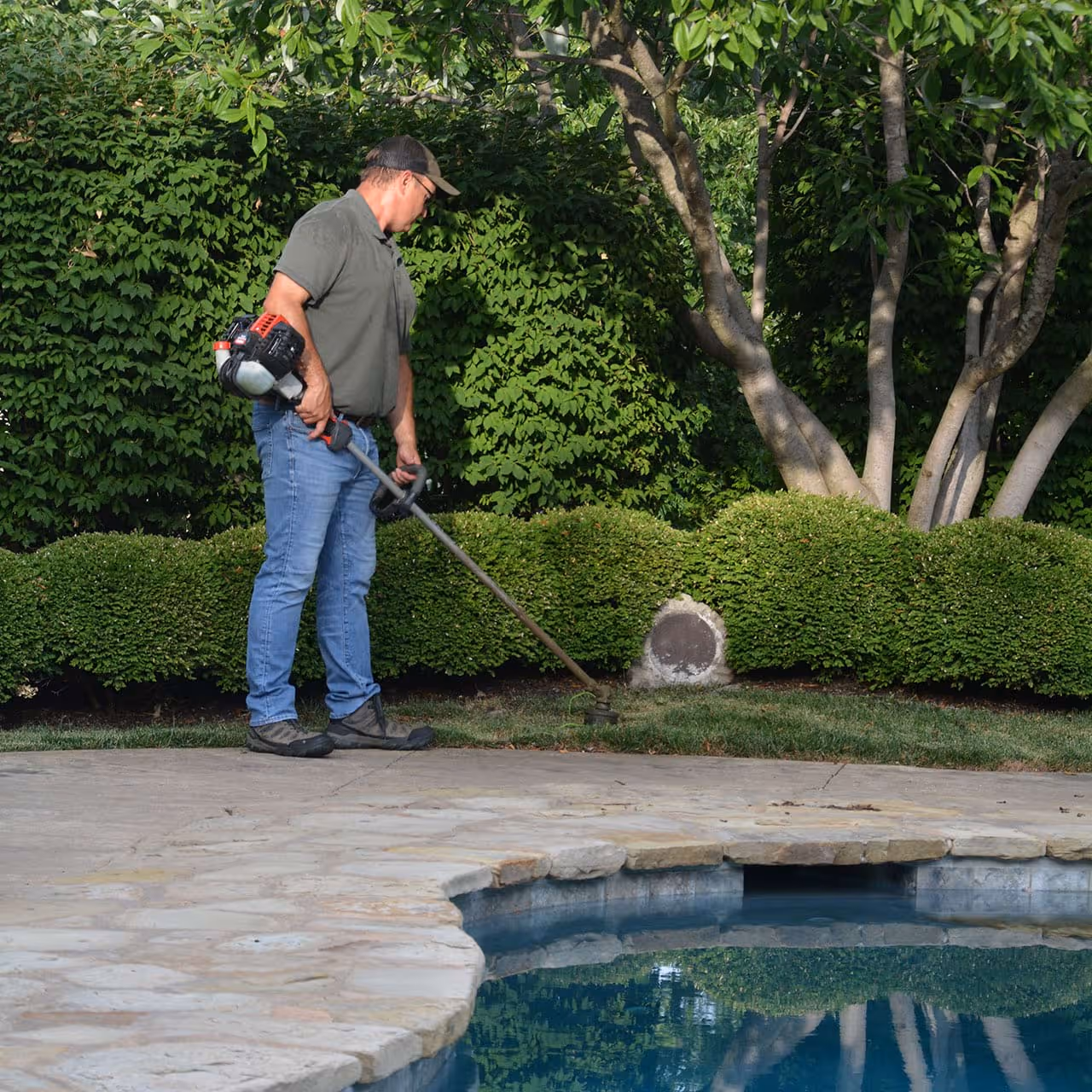 String trimmer detailing around flower beds for polished curb appeal near me