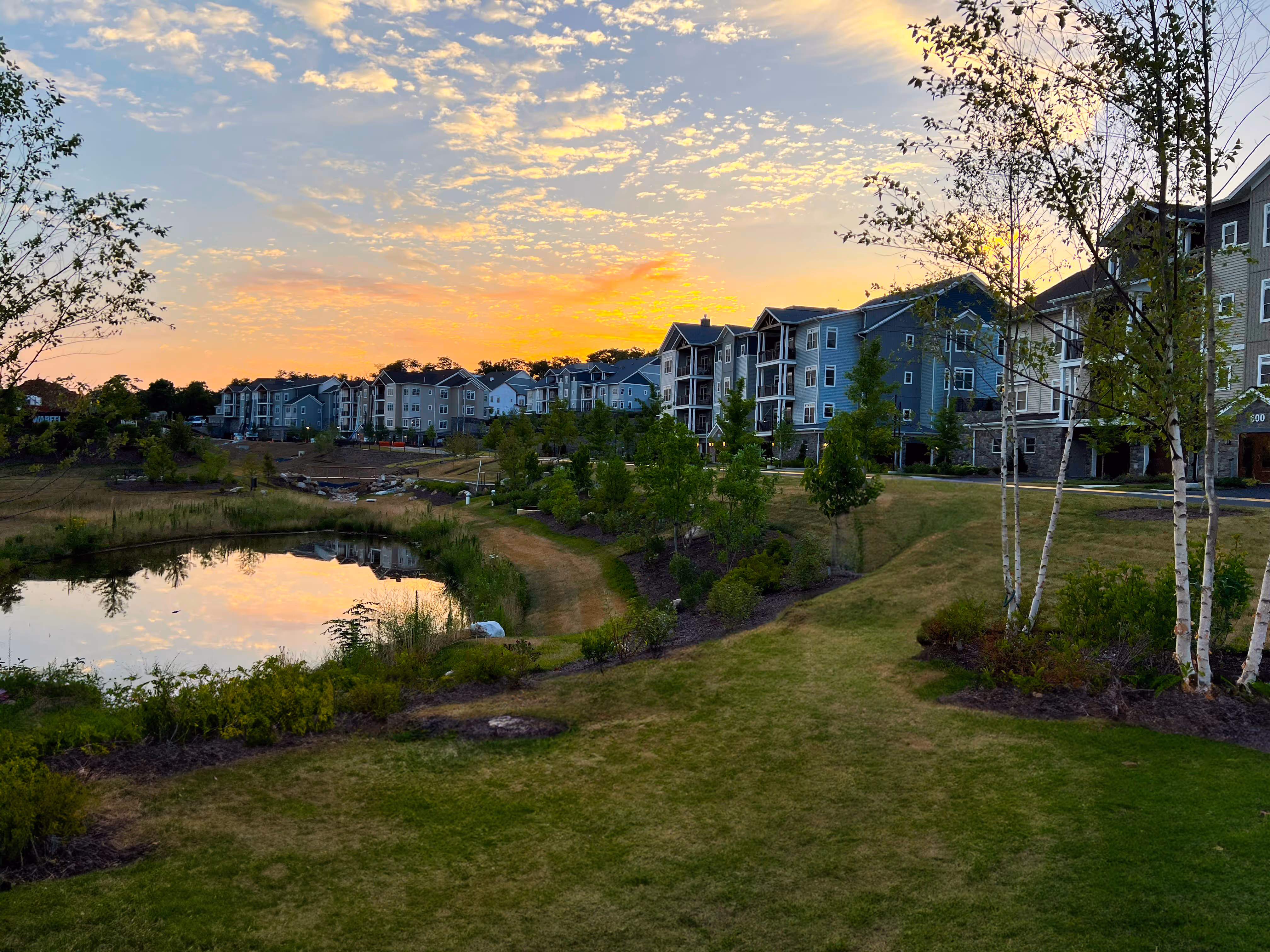 The sun sets on the Villas near the pond