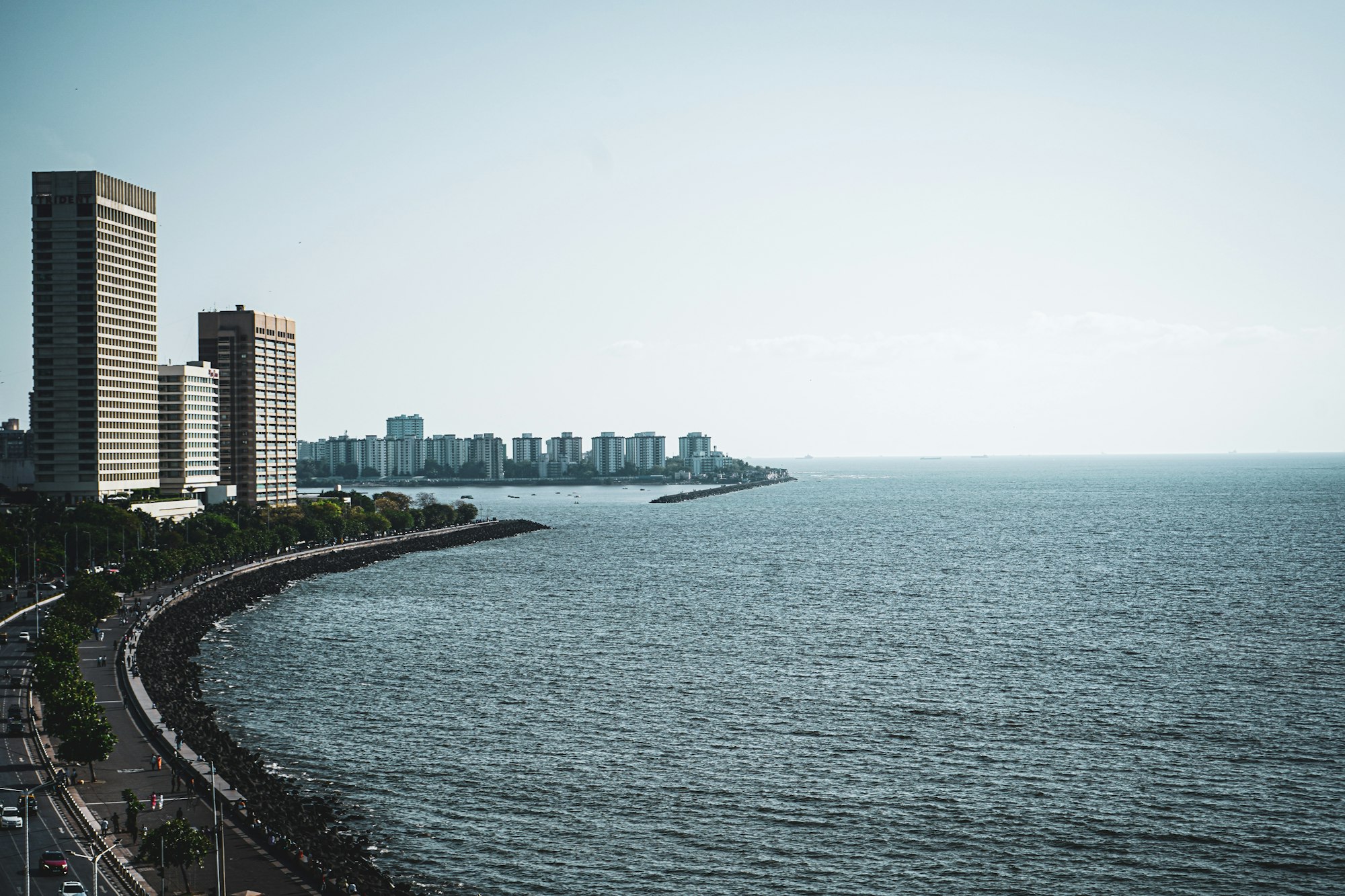 Mumbai skyline across the water from Marine Drive