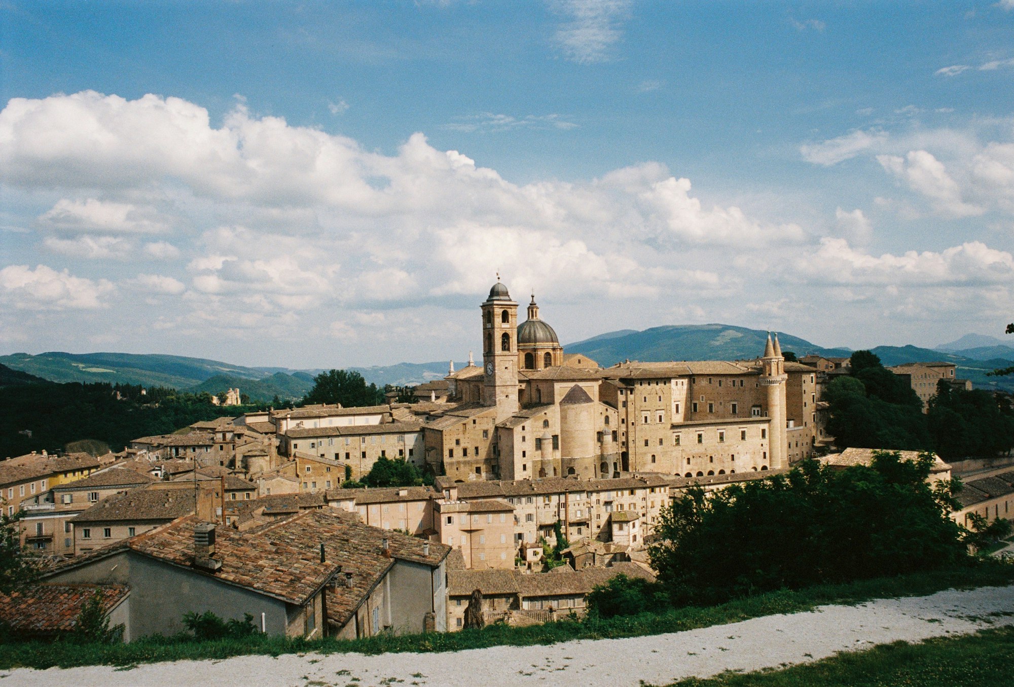 Urbino with its cathedral and Ducal Palace under a blue sky