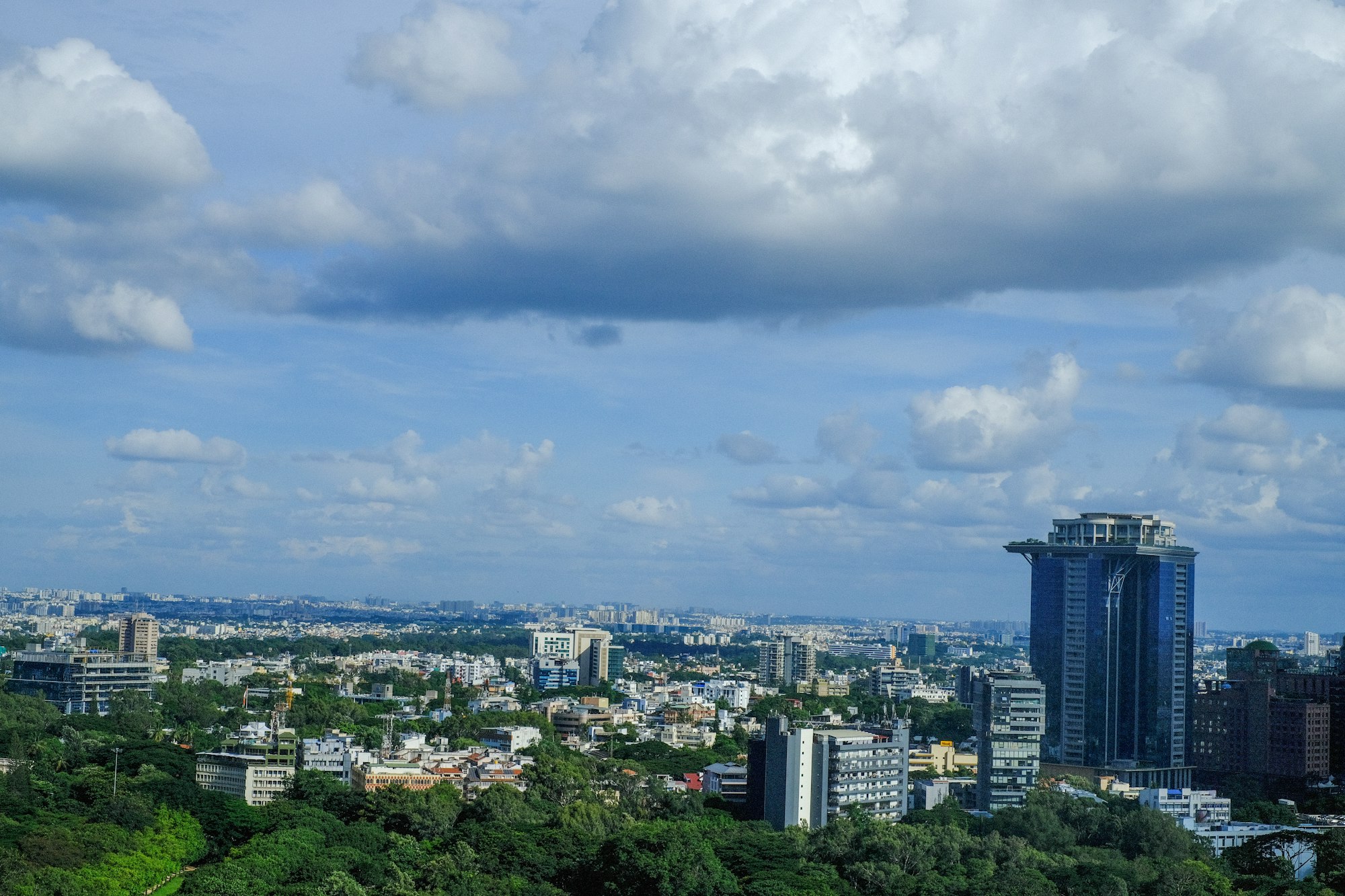 Bengaluru skyline with high-rise buildings and clouds