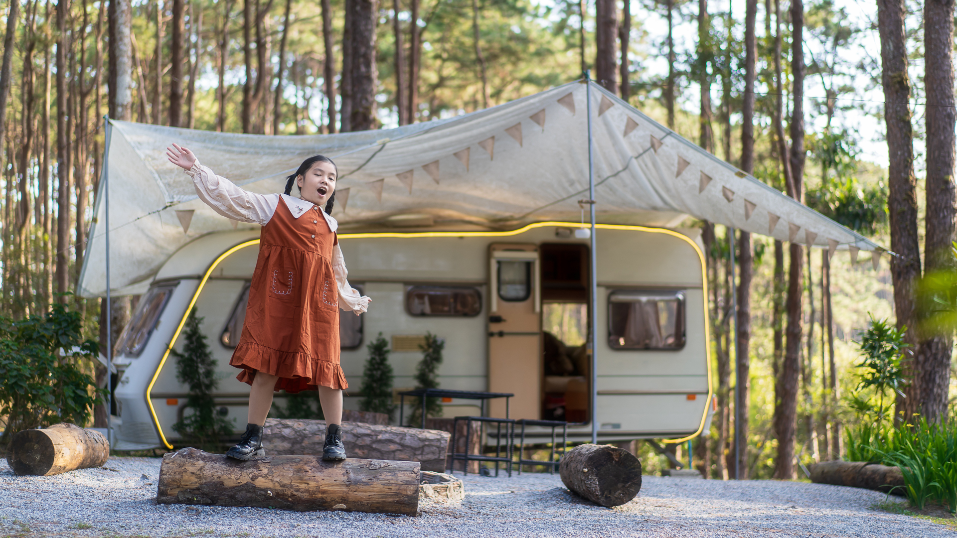 Child playing on campsite. Credit: Kornnphoto/ Adobe Stock
