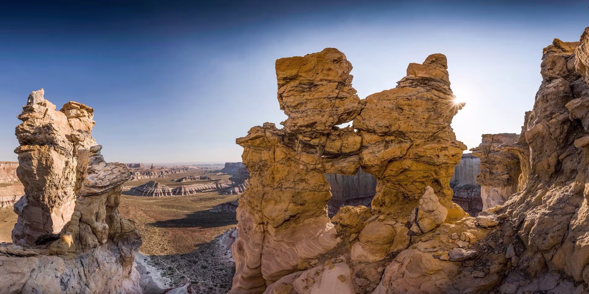 Coal Mine Canyon, Tuba City, located on the Navajo Nation with hoodoos, spires, and vibrant red, white, and black rock layers. Credit: Arizona Office of Tourism