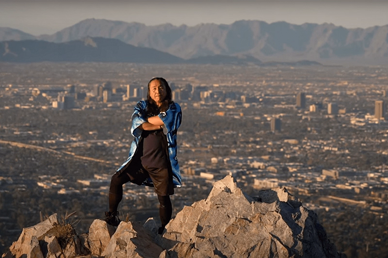Arizona Revealed Ken Koshio standing on mountain