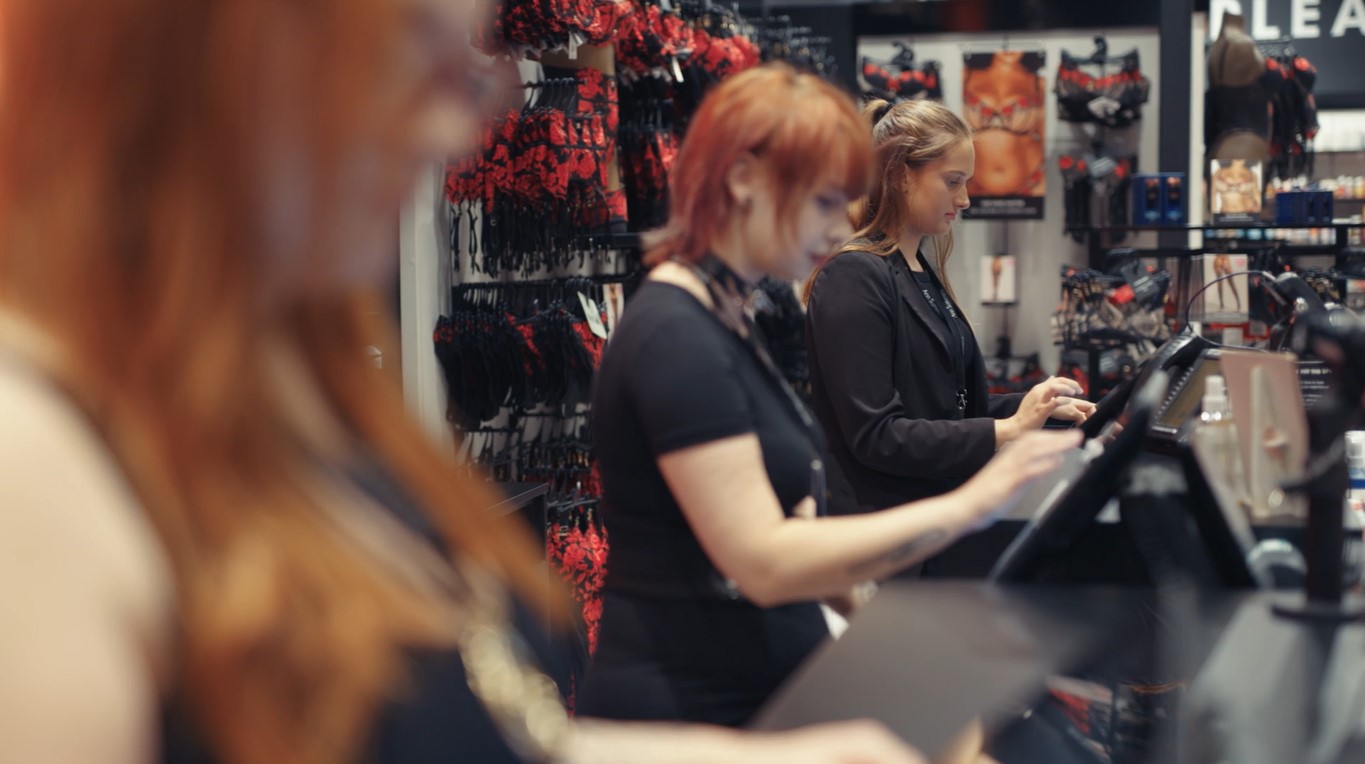 Ann Summers retail employees working at tills