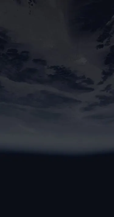 A cloudy planet with the black void of space below it.