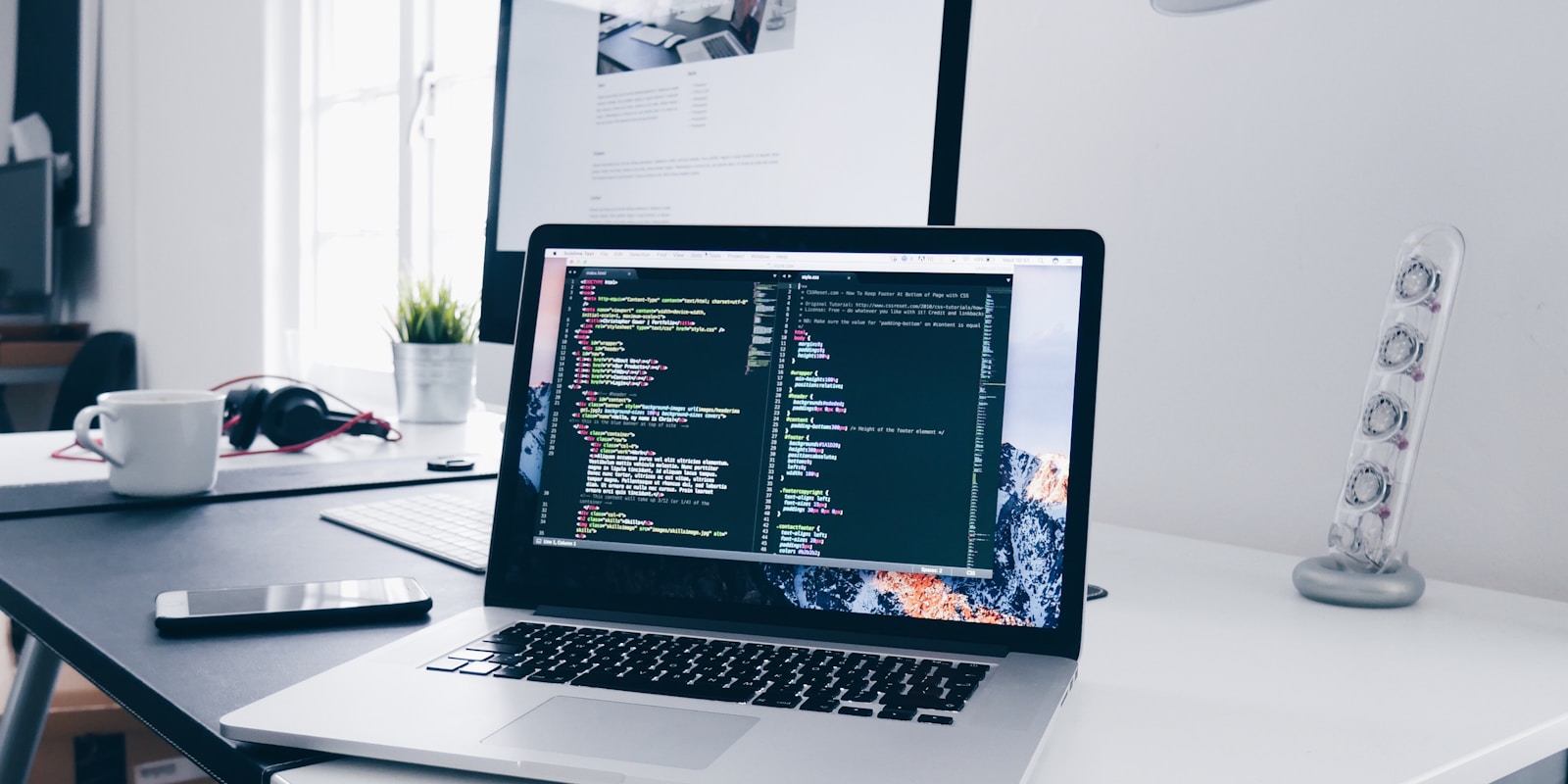 Modern workspace with laptop and technology tools for startup efficiency - StartupStage Blog
