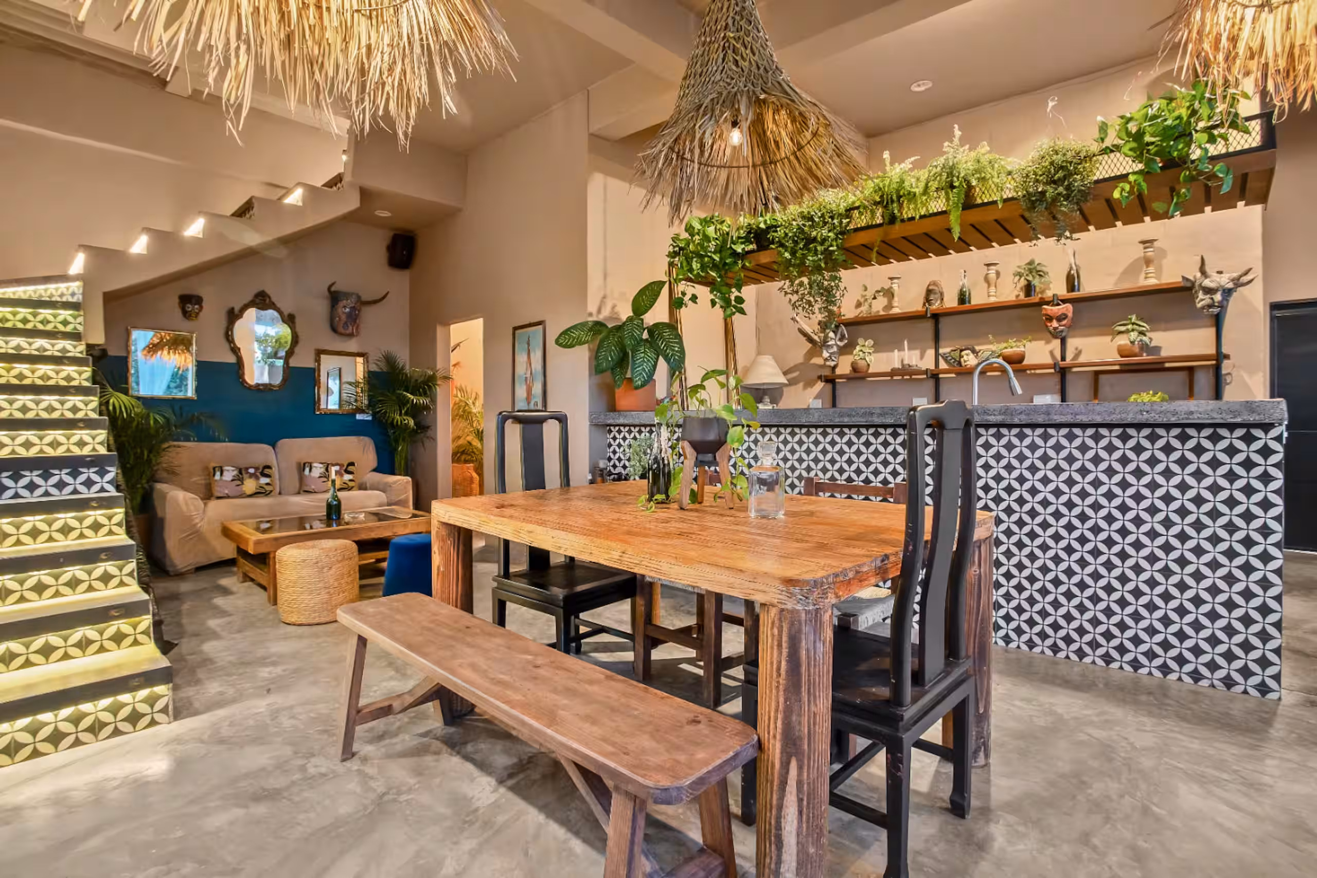 Open kitchen with a stone counter and windows onto the hillside.