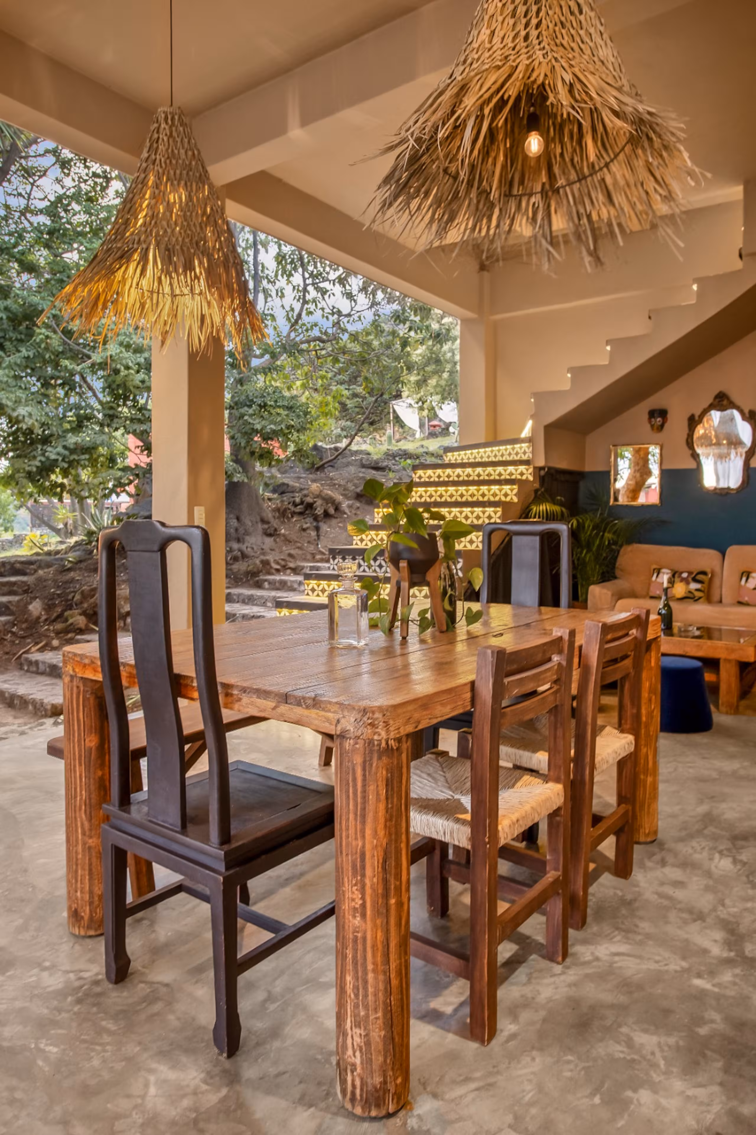 Second dining area with a long wooden table and bench seating.