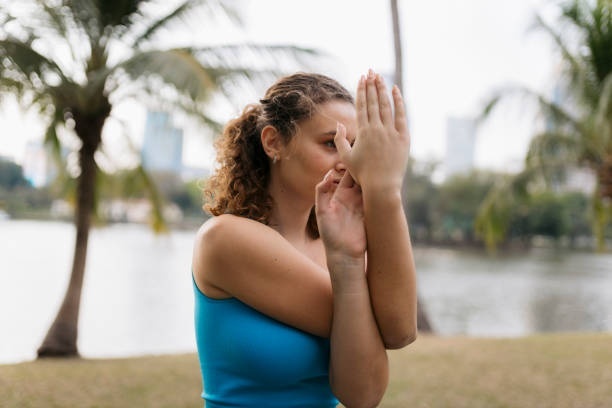 Woman doing eagle arms for improved flexibility in hands and wrists.