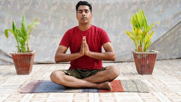 A man in meditation doing the eye yoga rolling exercise.
