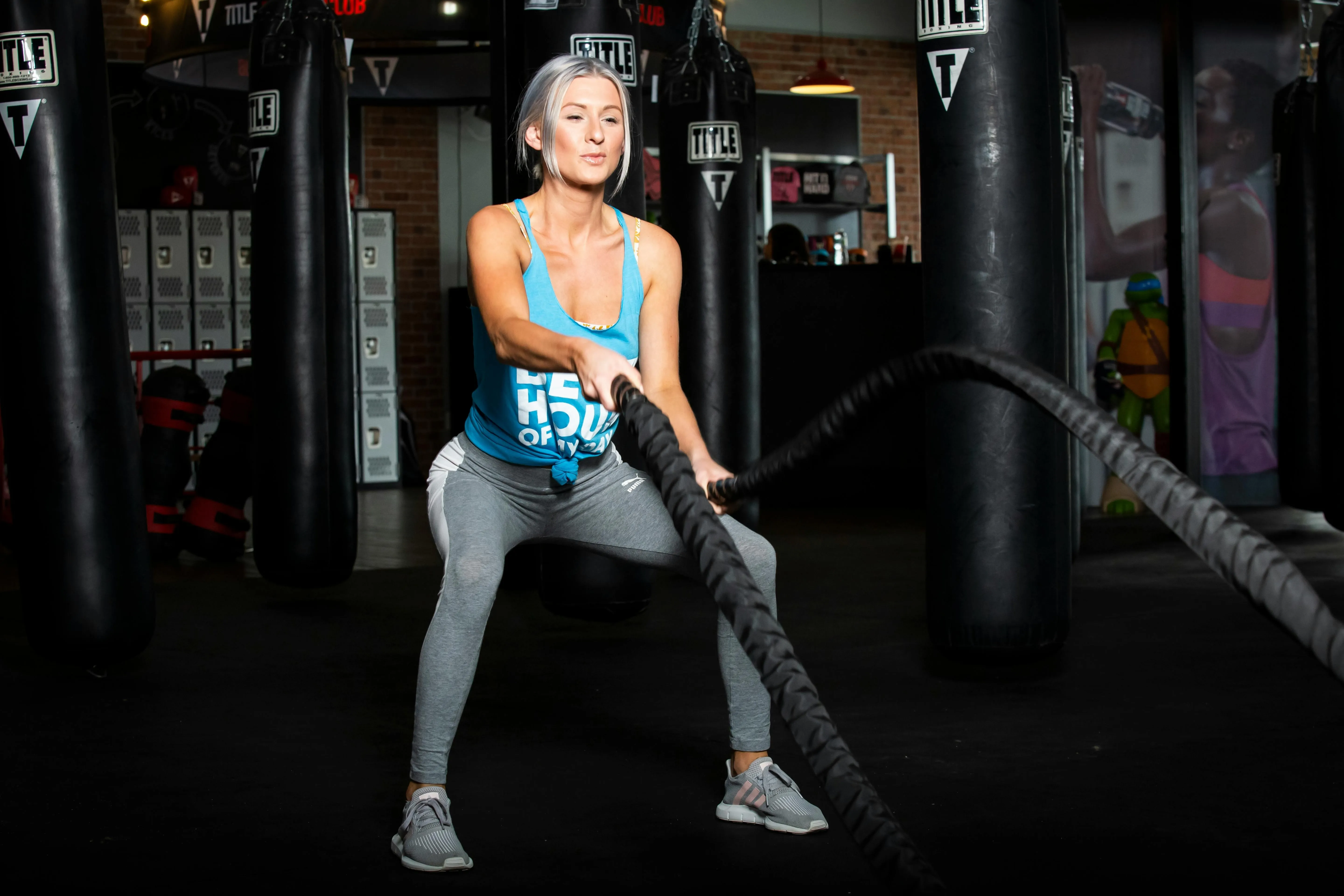 pexels-web-daytona-3436535-5128328.jpg A woman using gym equipment for her workout.