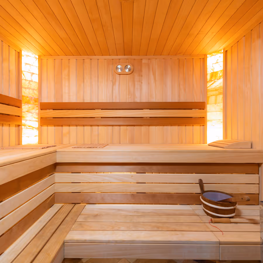 Sauna with ambient lighting. It looks warm inside, and makes you want to sit down after your workout.