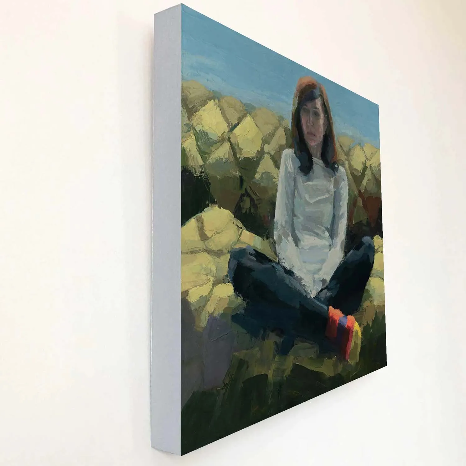 oil painting of artist sitting on a green couch