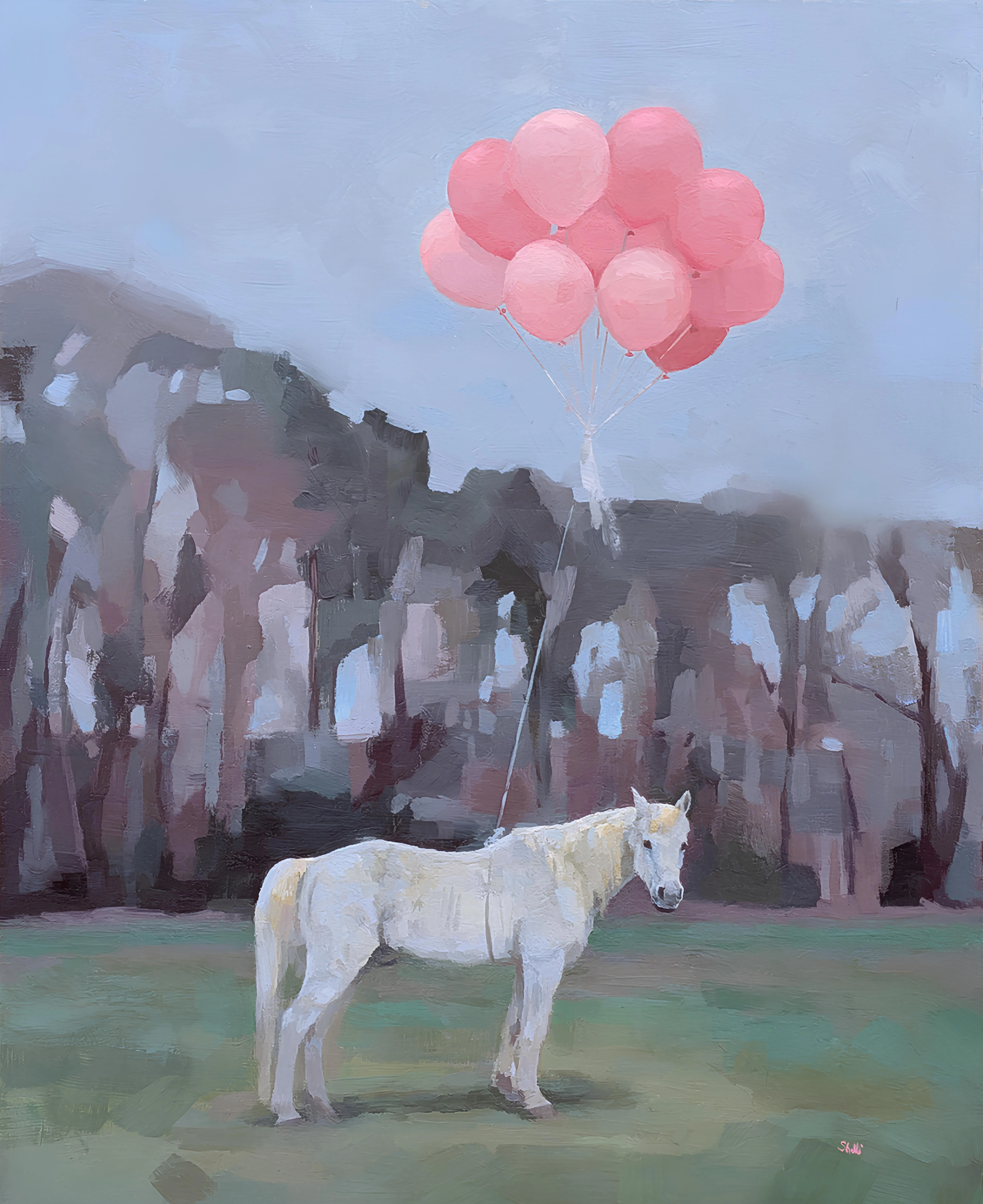 grey-white horse tethered to a bundle of pink balloons standing in a green pasture with treeline in background