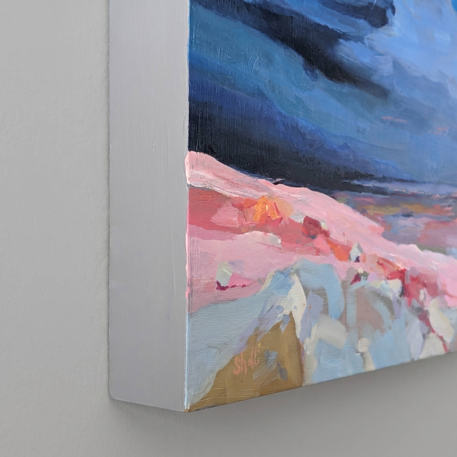 acrylic painting of a celestial body in a dark blue expanse surrounded by sky from the perspective of another celesital body with a pink and red landscape