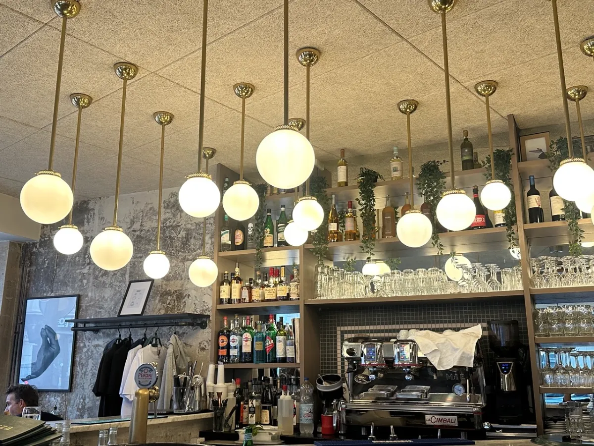 Bar at Zazza with hanging lights.