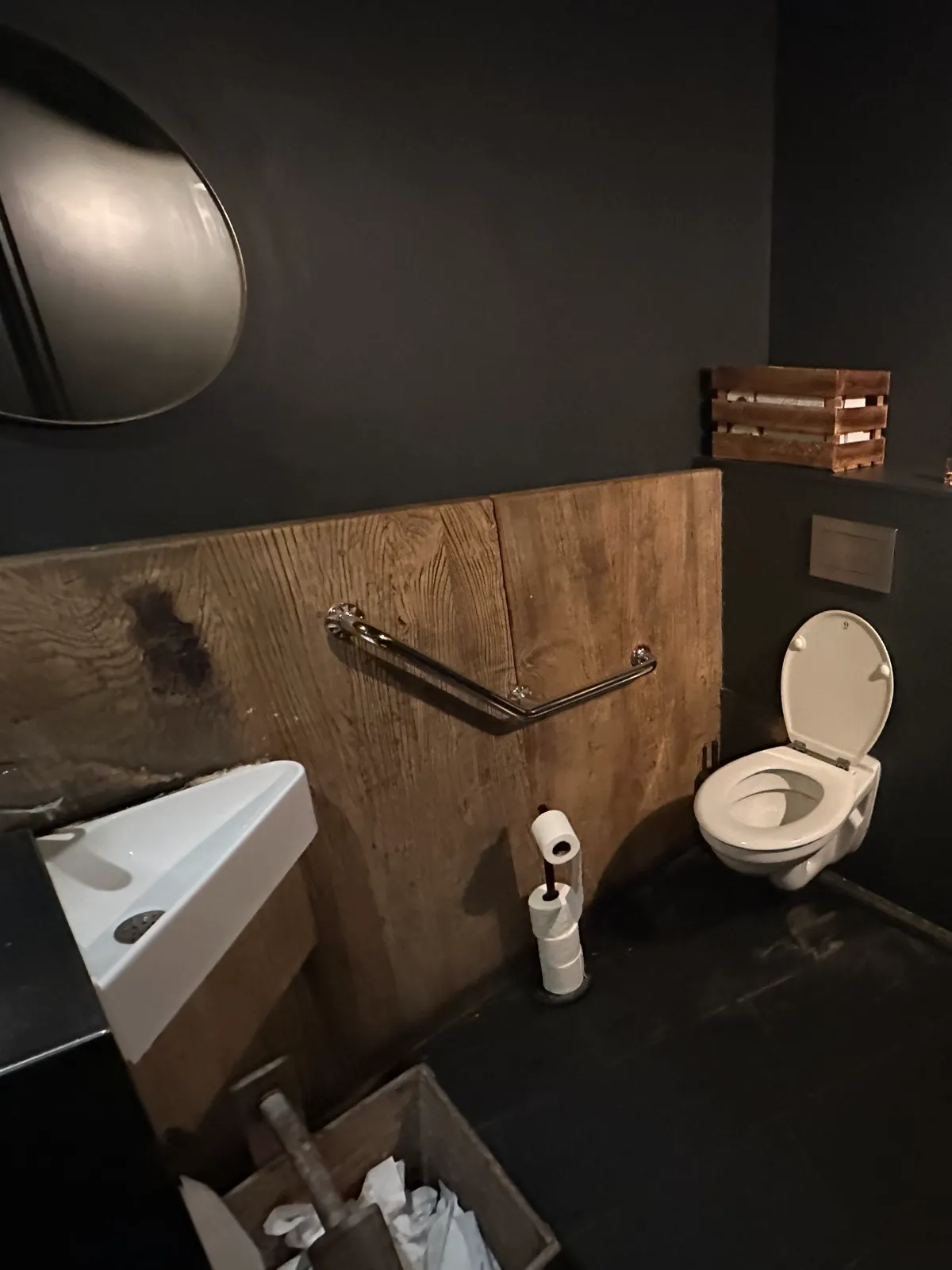 Accessible toilet at Breizh Café Odéon showing oversize bin in whiich reduces turning space 