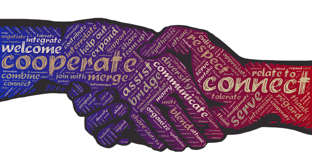 Handshake formed from words like cooperate, connect and communicate