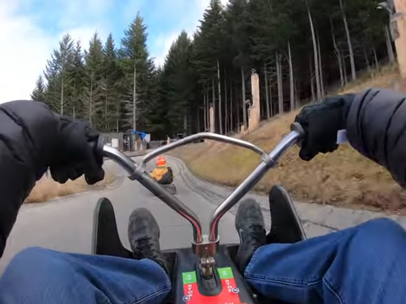 First-person view riding a luge down the track in Queenstown