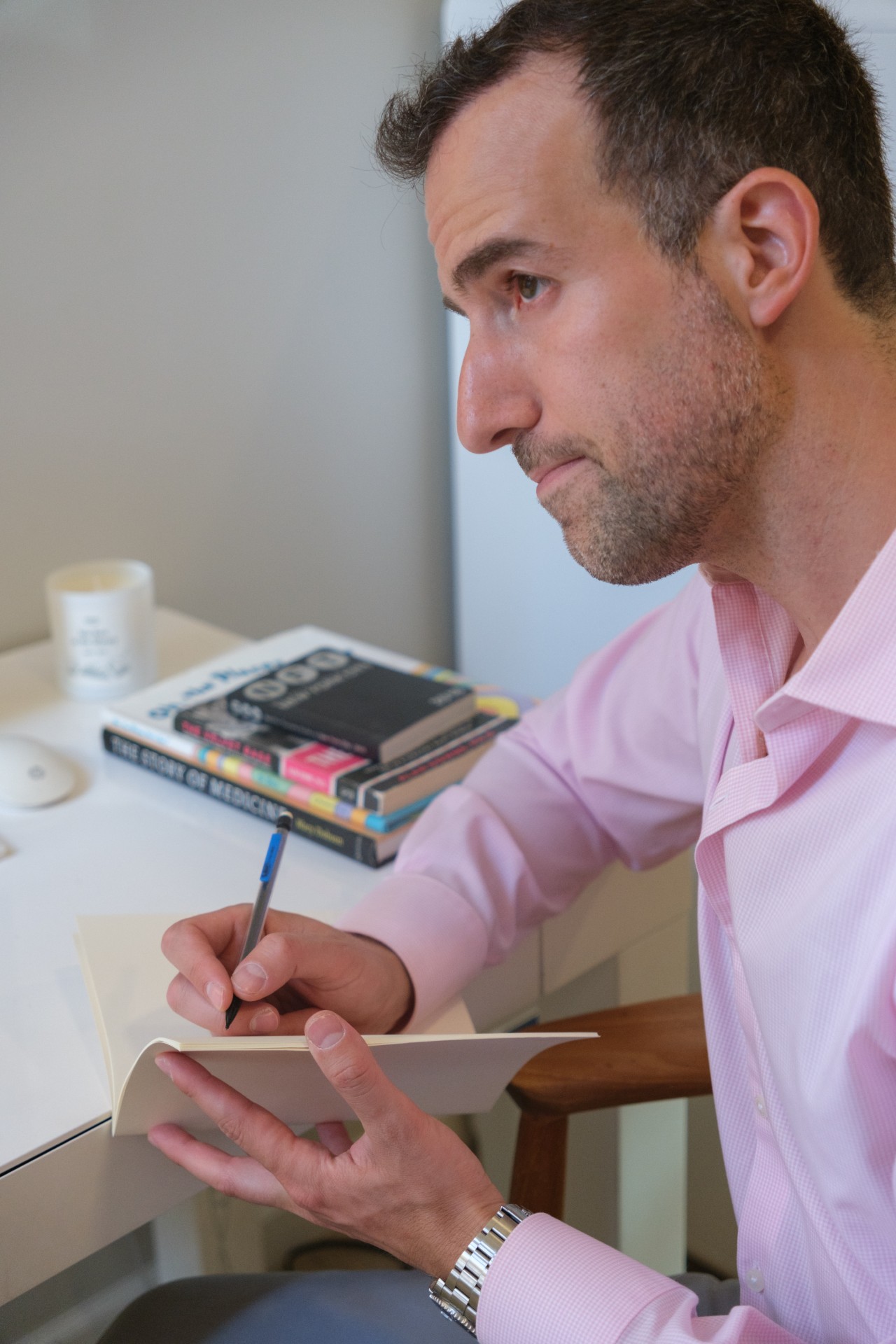 Dr. Noy, writing notes Arium psychiatry practice NYC