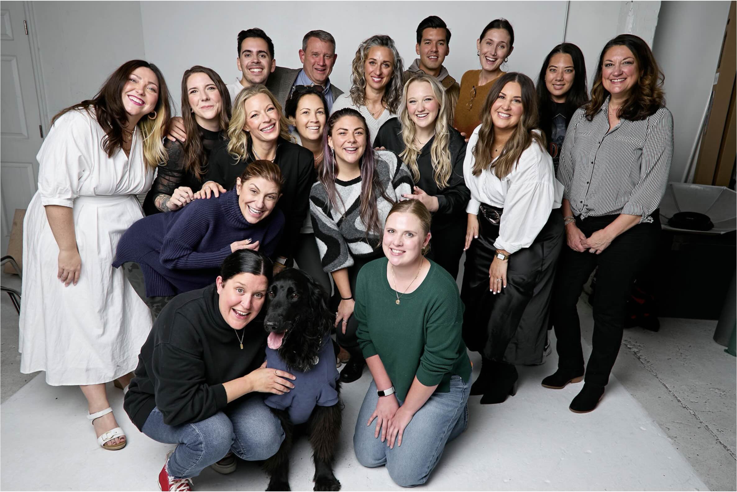 Large group of EES employees posing in a studio.