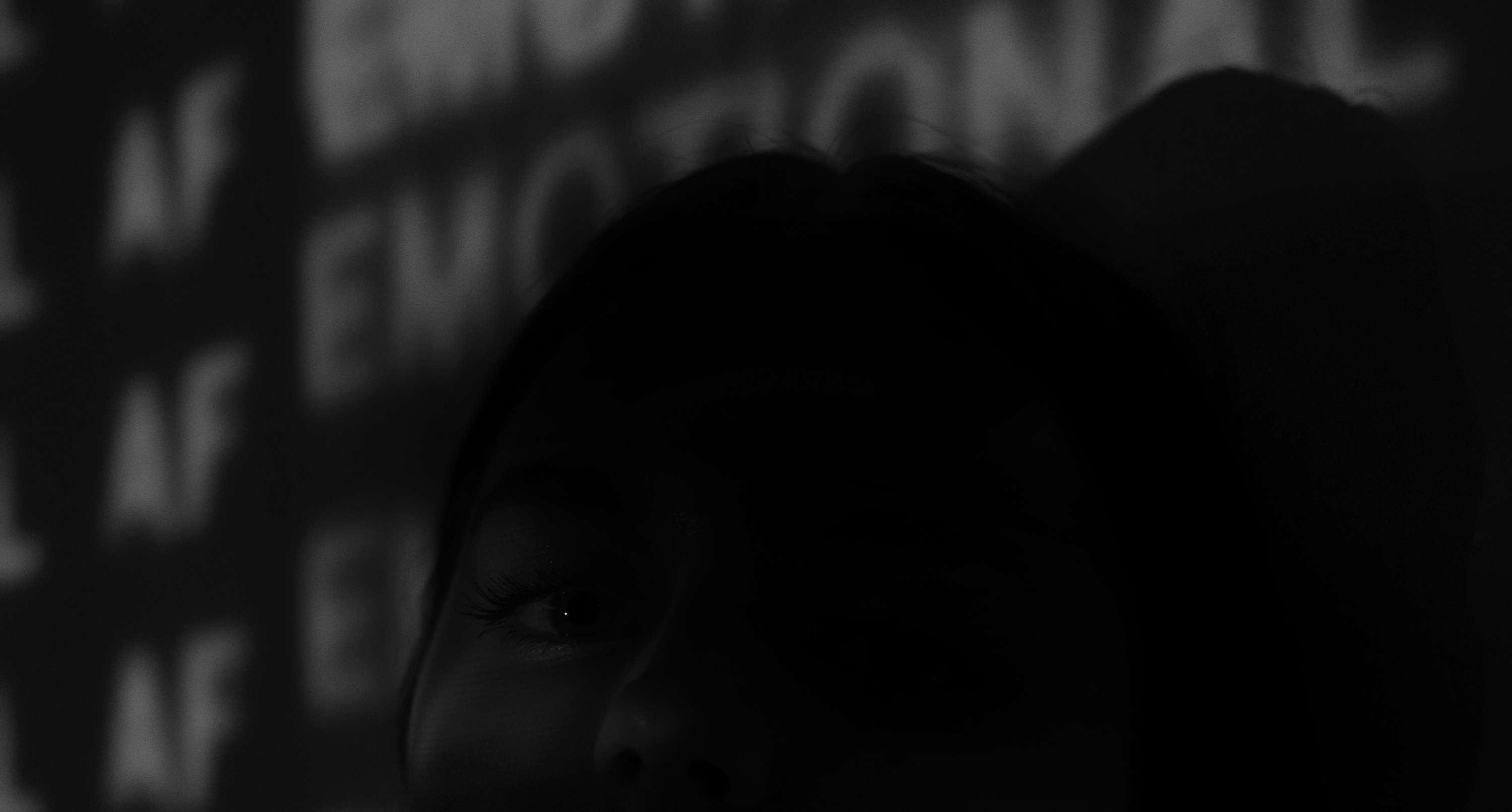 Cintia Nardella. Woman un the shadows with words highlighted