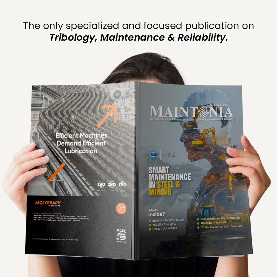 Person holding Maintonia magazine, featuring smart maintenance in steel and mining on the cover.