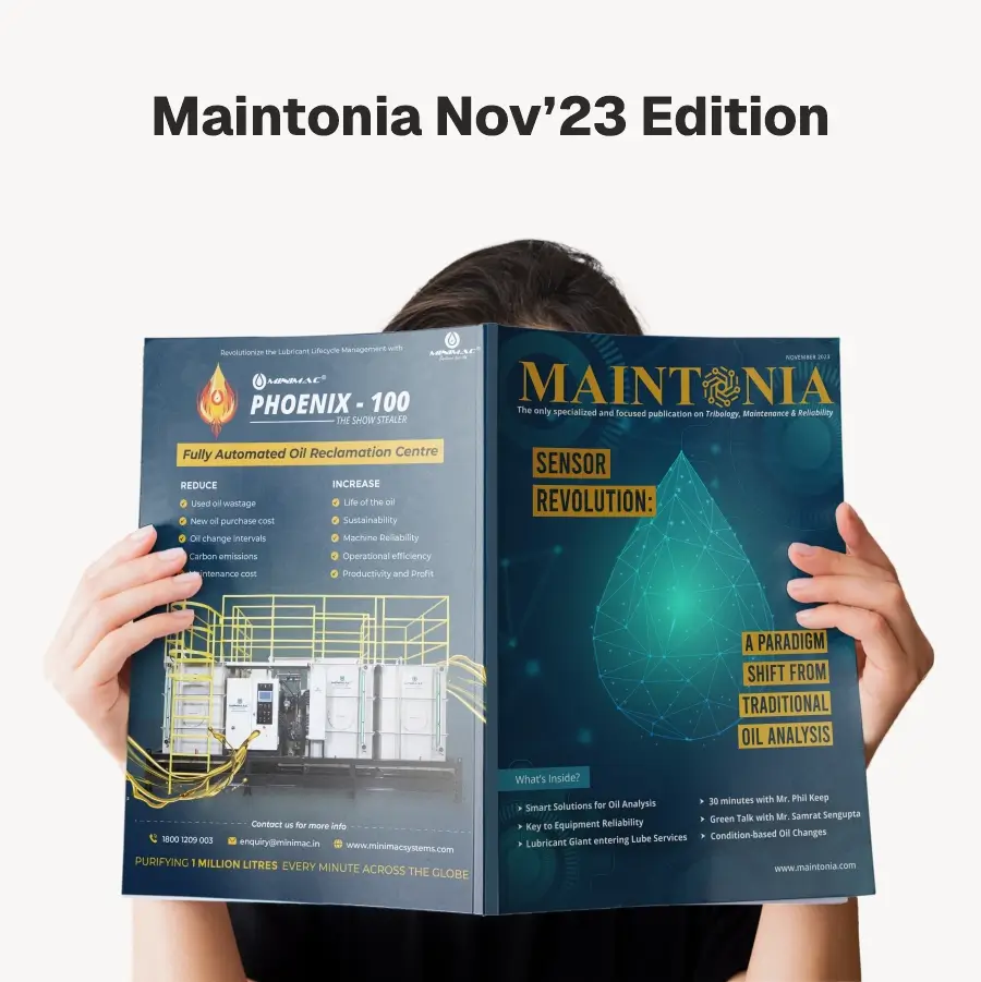 Person holding open the Maintonia Nov’23 Edition magazine with headlines on sensor revolution and automated oil reclamation technology.