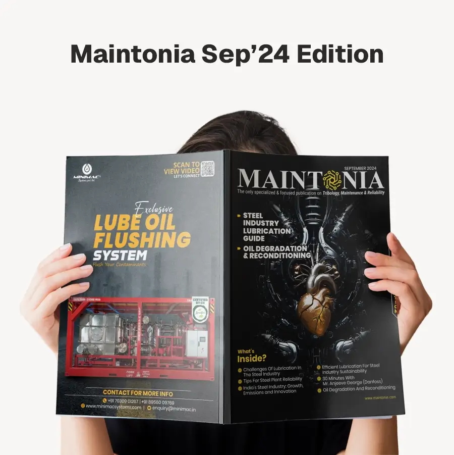 Person holding open the September 2024 edition of Maintonia magazine featuring articles on steel industry lubrication, oil degradation, and a lube oil flushing system.