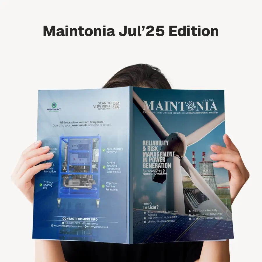 Person holding the Maintonia Jul'25 Edition magazine featuring a wind turbine and power generation reliability on the cover.