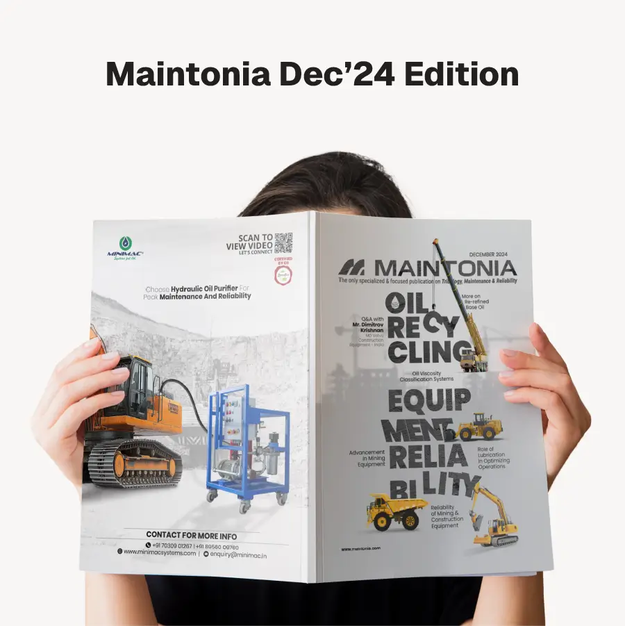 Person holding the Maintonia Dec’24 Edition magazine featuring articles on oil recycling, equipment reliability, and mining machinery.