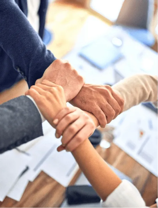 person in black long sleeve shirt holding persons hand