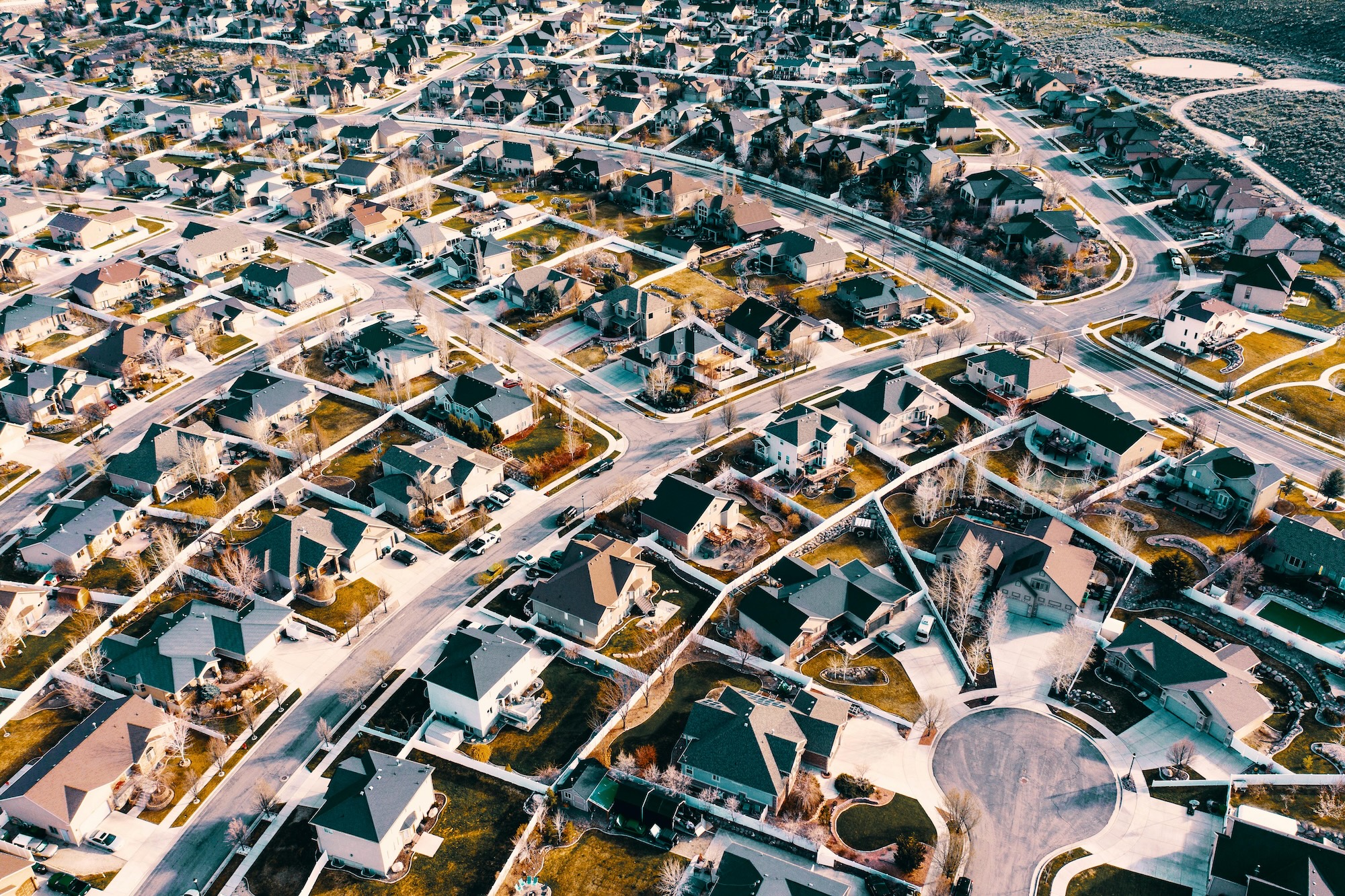 Overhead shot of Dallas neighborhood with single-family houses we buy for cash