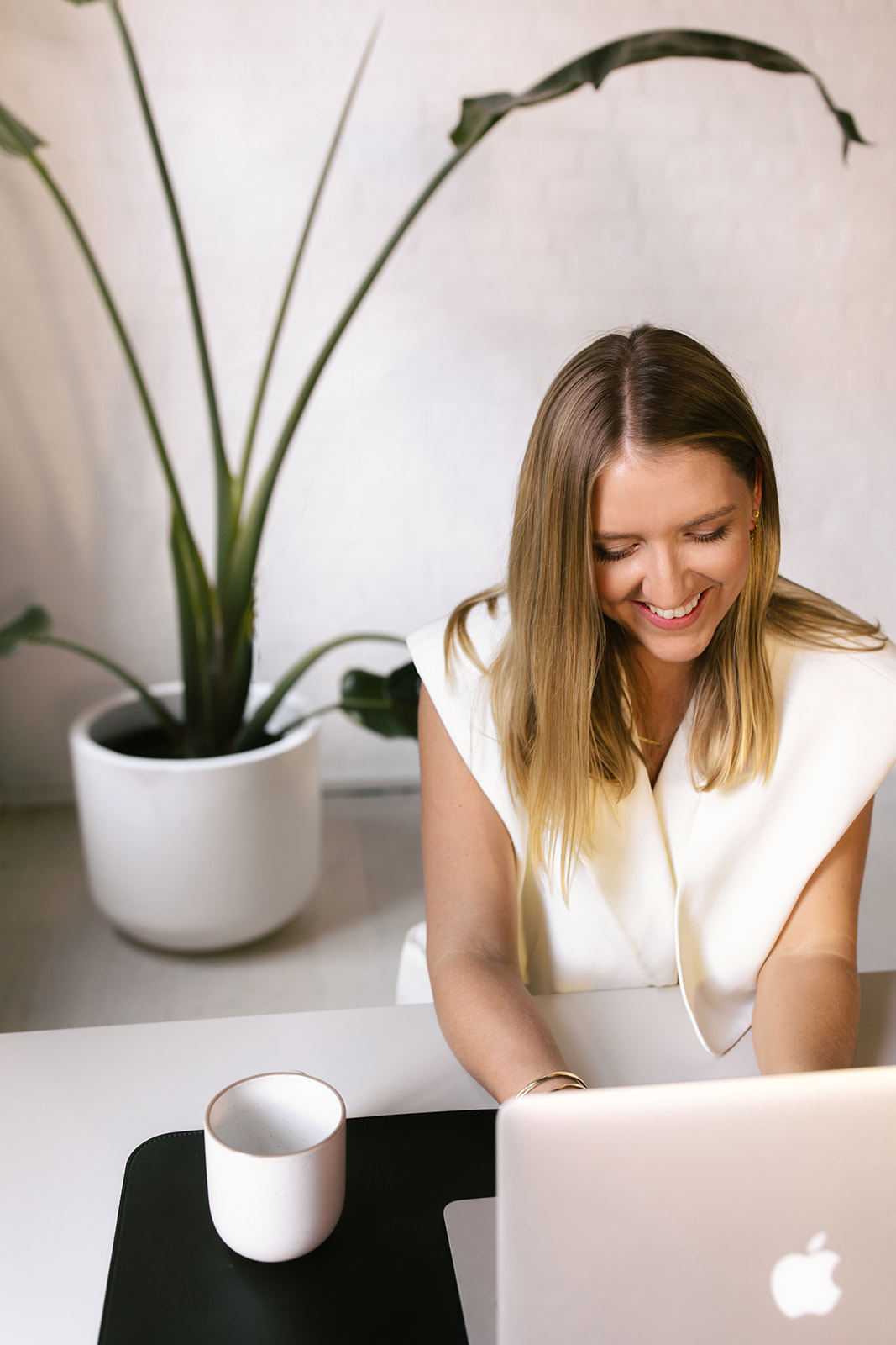 Jillian Wealth's KiwiSaver adviser, Ella Leslie, writing notes from a client meeting.