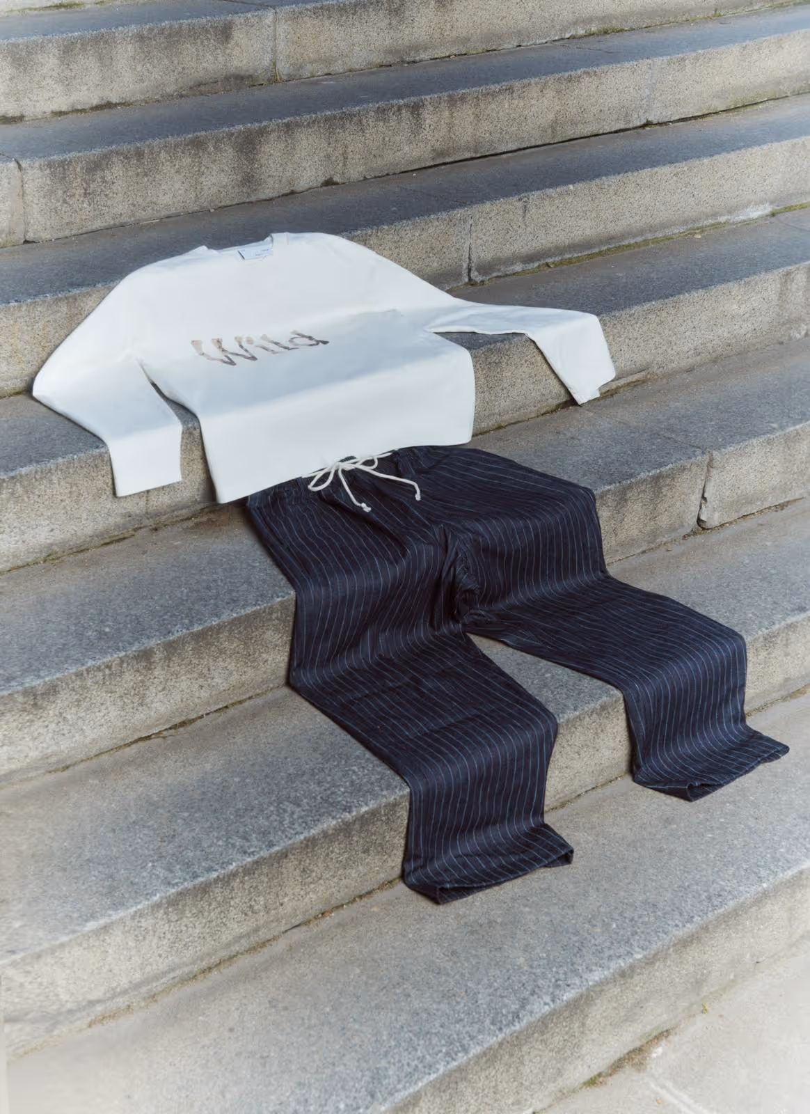 THE SAVAGE REPORT: Clothing drapes dramatically on concrete steps