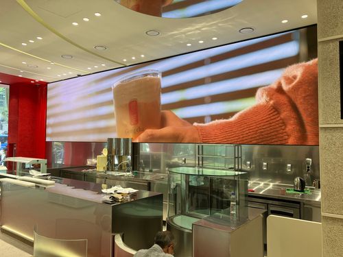 Gong cha digital LED display showing product information and a menu