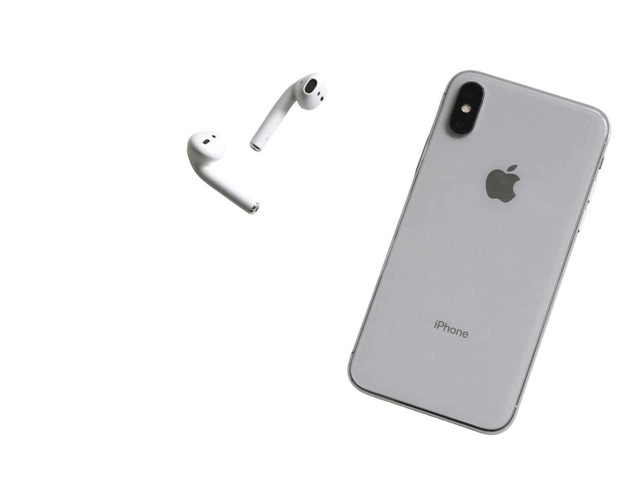 Silver iPhone with dual rear cameras next to a pair of white wireless earbuds on a black background.