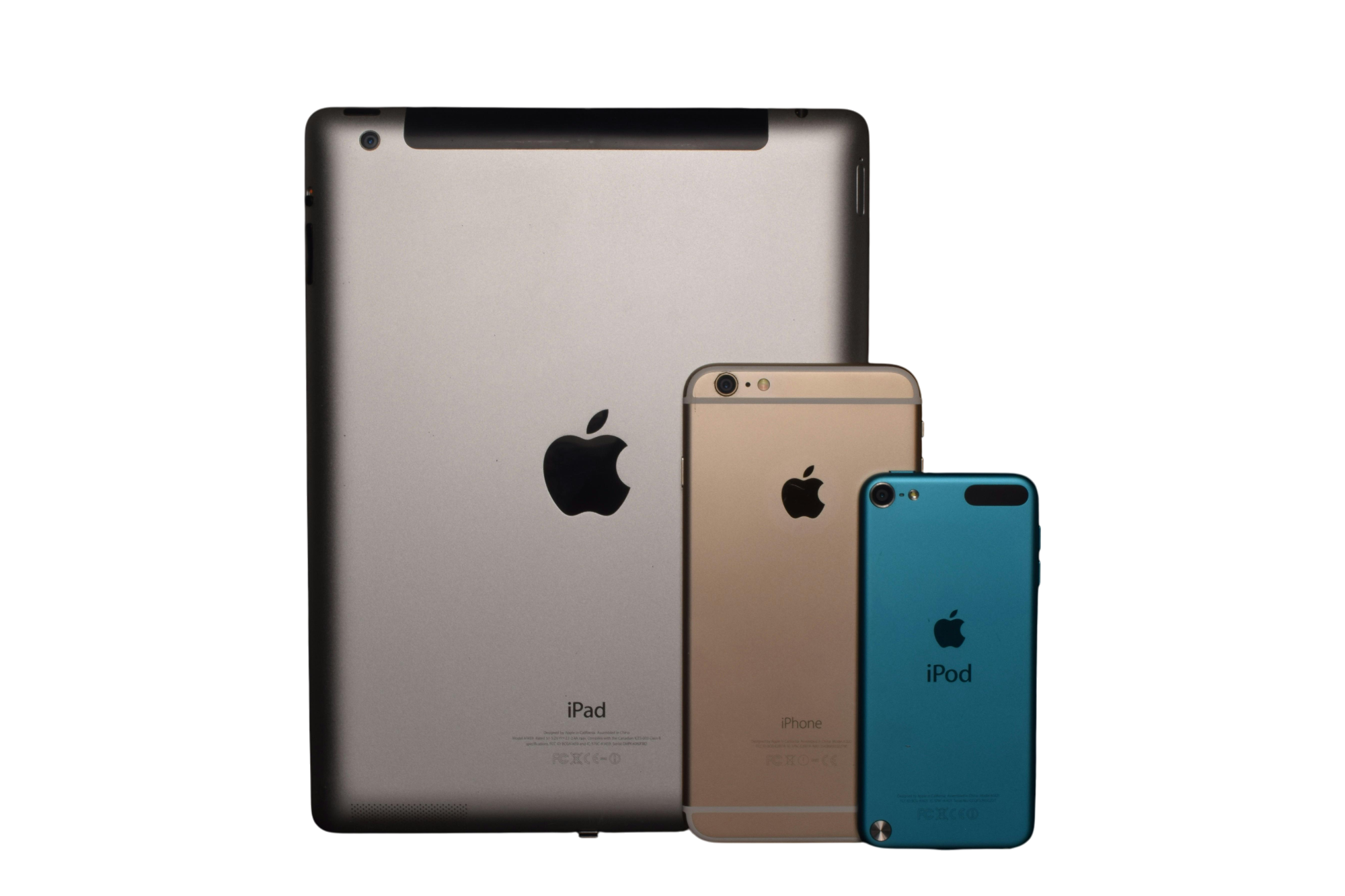Back view of a silver iPad, gold iPhone, and blue iPod placed side by side on a black background.