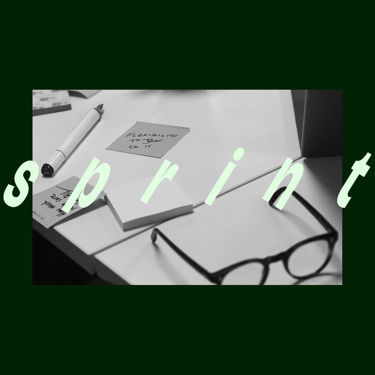 Black and white photo of a desk with a pen, sticky notes, and a pair of glasses, with the word 'sprint' overlaid in large white letters.