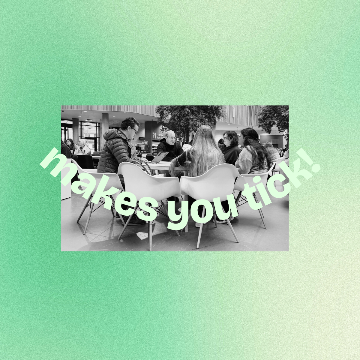 Group of people sitting around a table in a modern indoor space, with large text overlay saying 'makes you tick!'