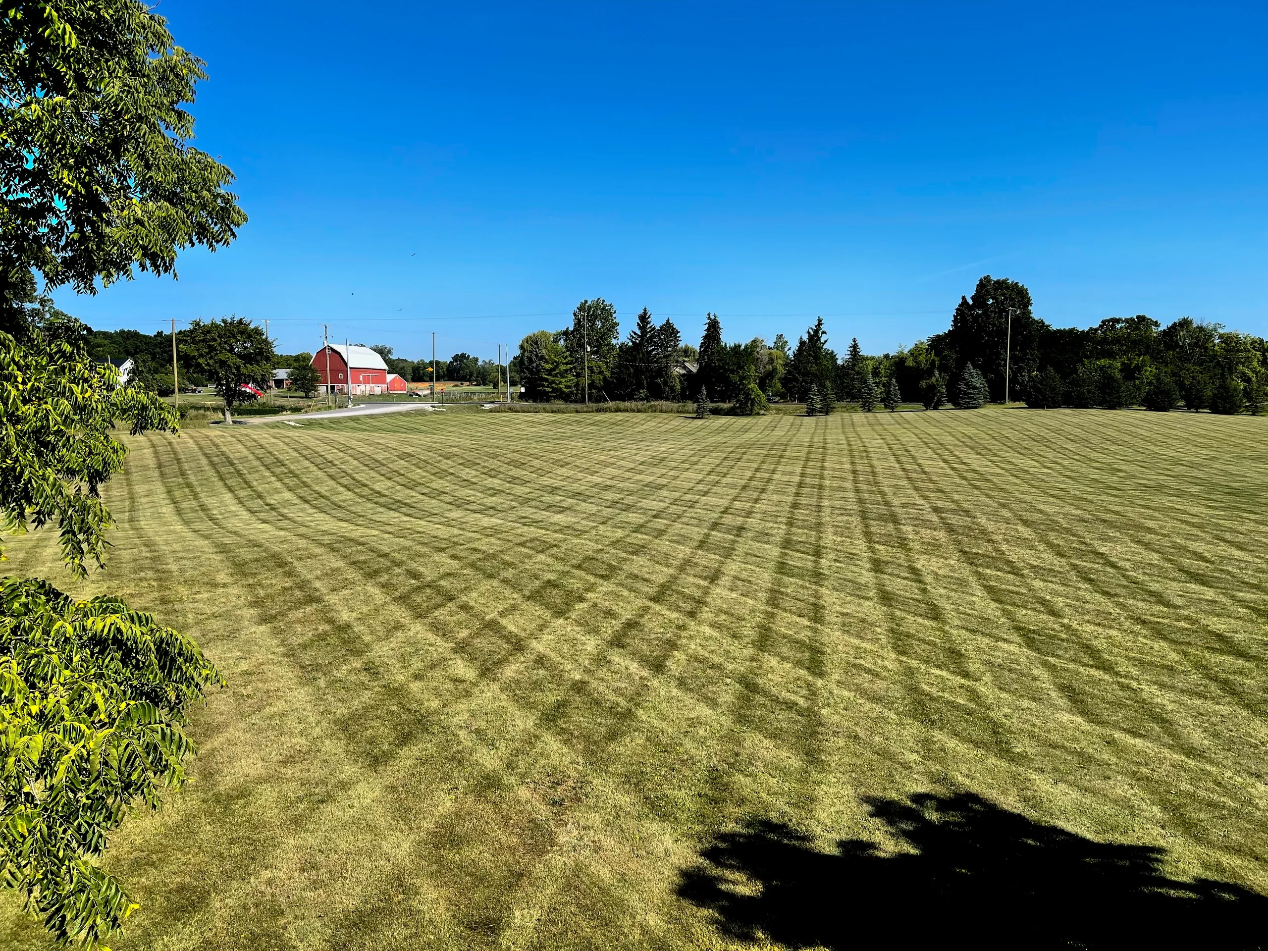 Large commercial field mowing and maintenance service by Jake's Lawn Care Michigan