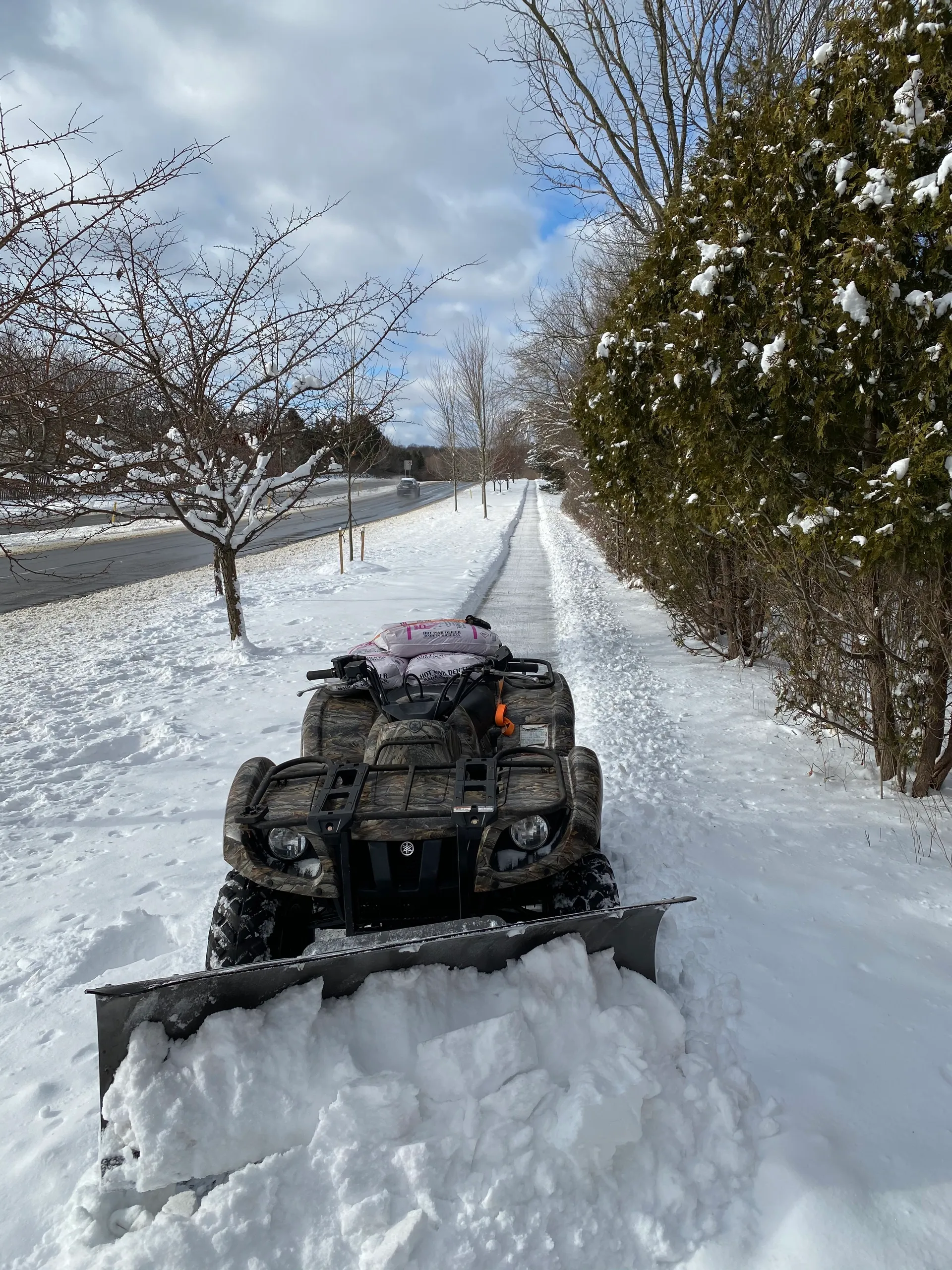 ATV snow plowing and residential winter maintenance services by Jake's Lawn Care Michigan