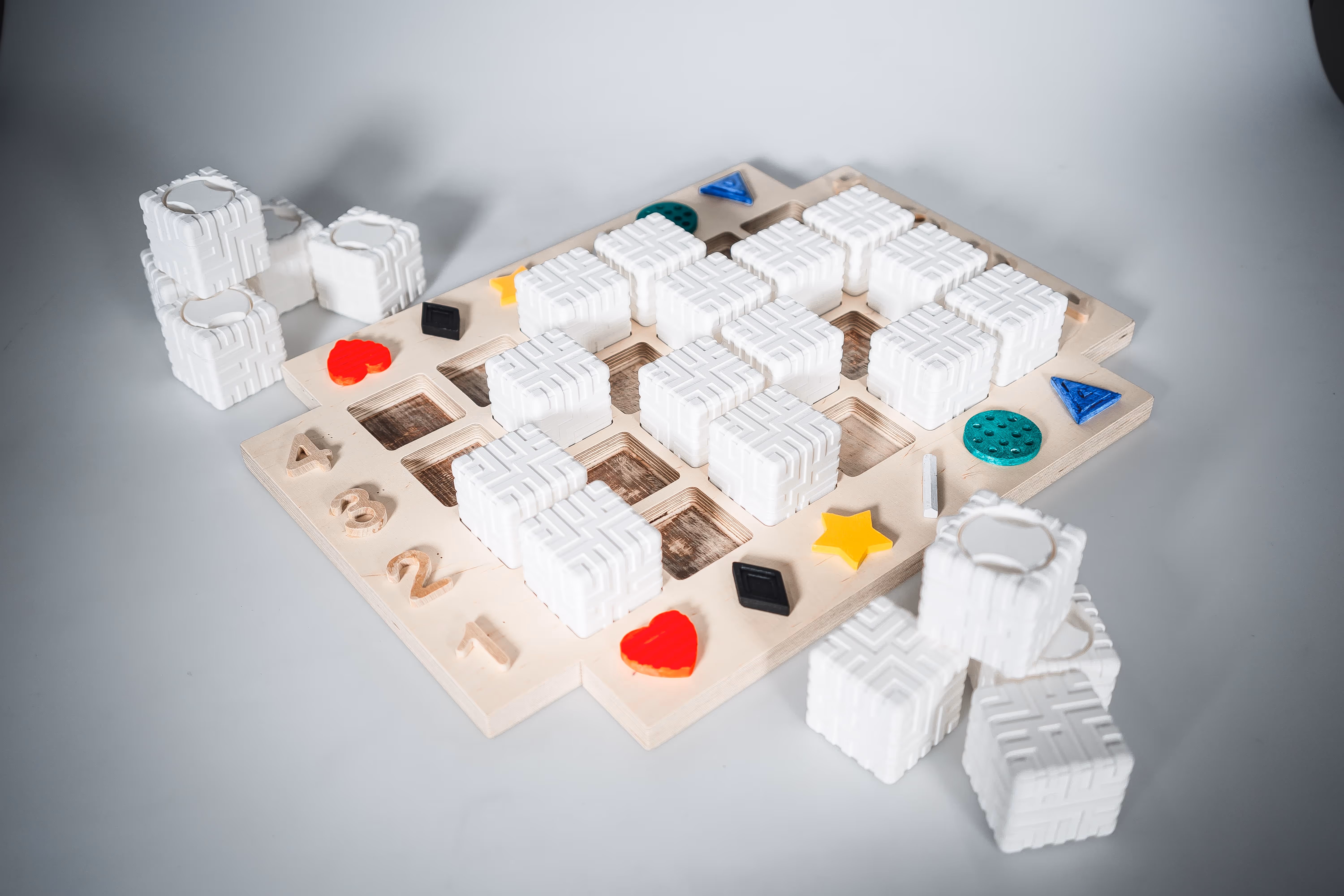 Photo of the visually impaired project game board as if it is being played by two players