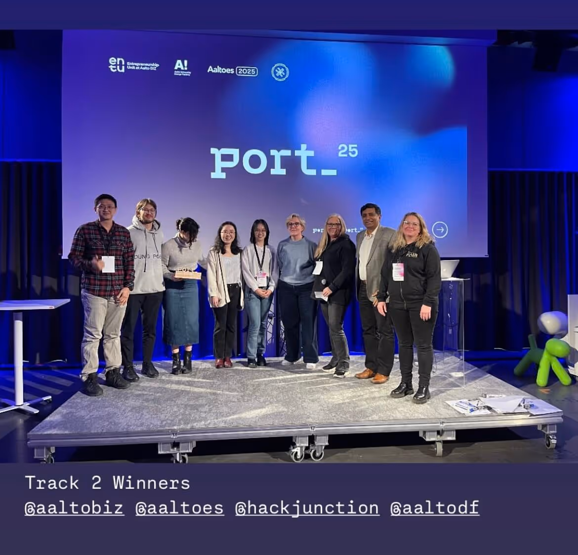 Picture of the entire winning Port hackathon team together with the judges