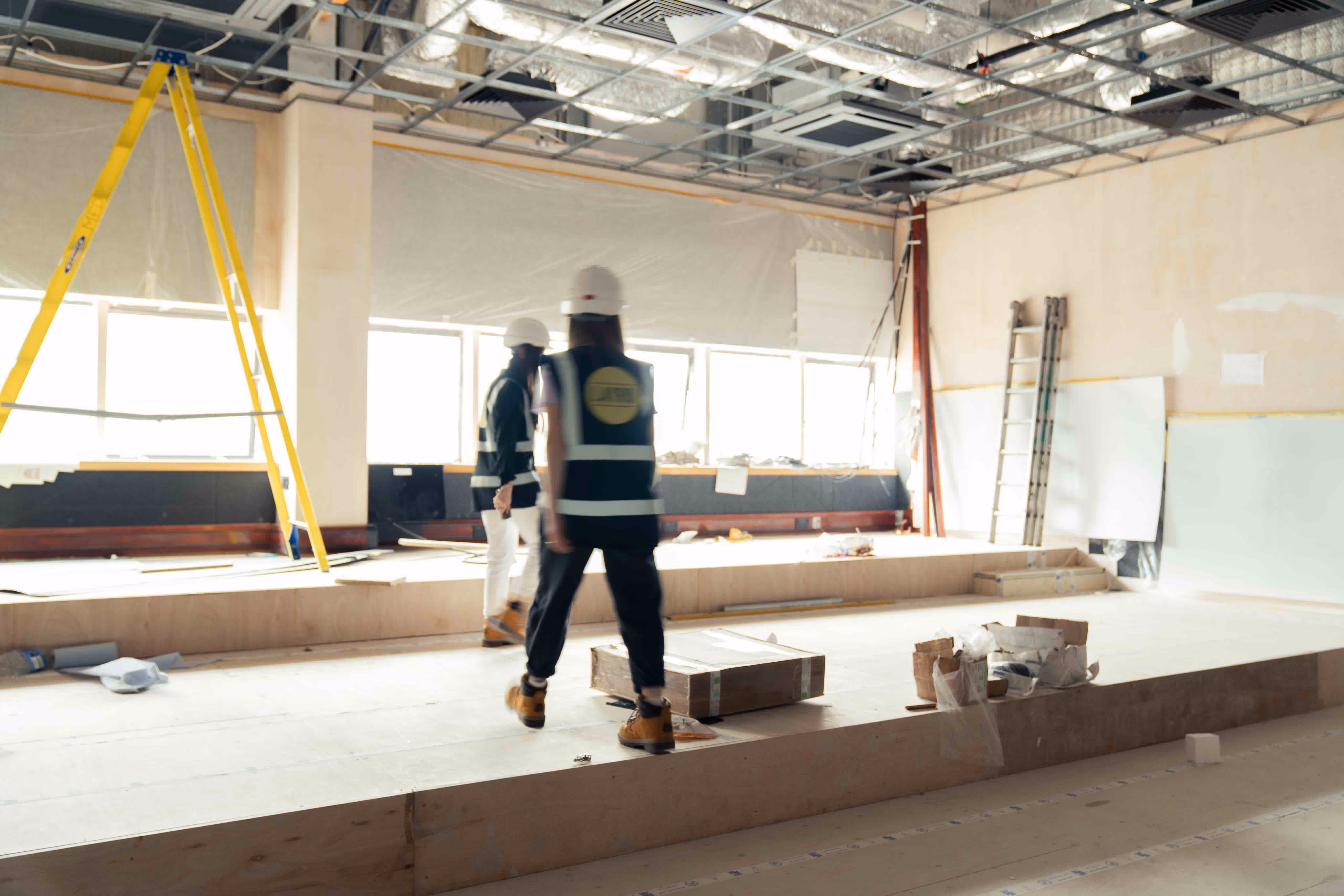 Interior designers inspecting a construction site during an office renovation project.