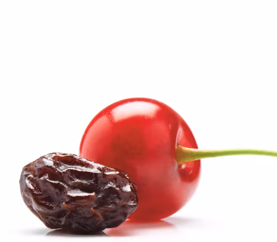 Dried cherry next to fresh cherry