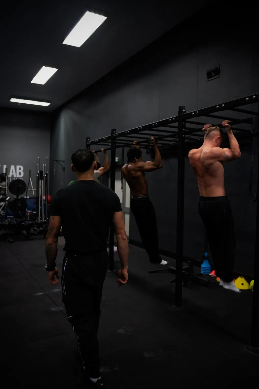 Ed coaching calisthenics to two people 