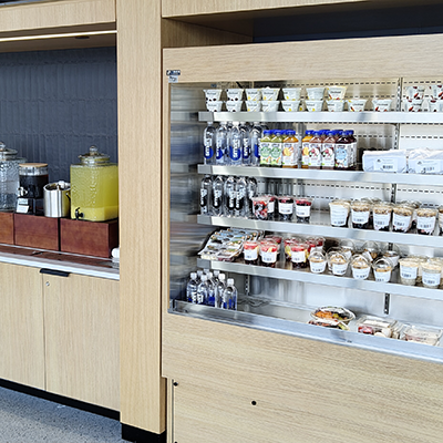 A pantry cooler with fresh packaged meals, snacks, and drinks.