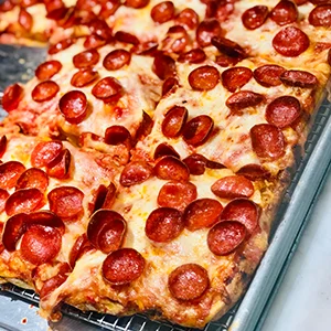 rectangular Detroit style pizza with pepperoni